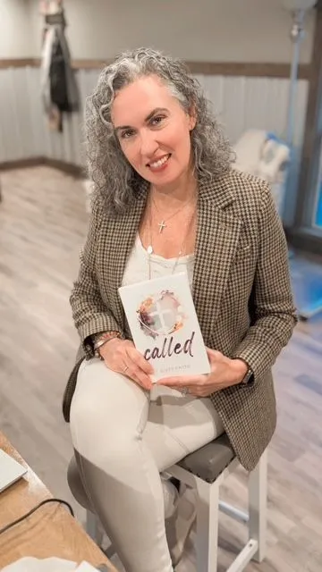 Buffy Payne holding her book Called